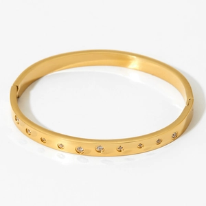 Elegant gold-plated stainless steel bangle featuring multiple inlaid white zircon stones