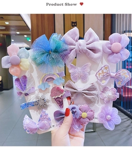 Detailed set of 14 colorful hair clips for girls including mesh bows and sequined flowers