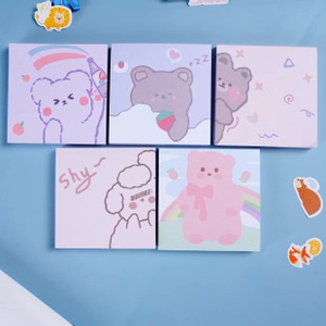 Set of 5 cute cartoon bear sticky notes in pink and purple colors on a blue background
