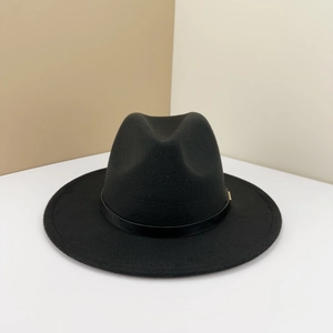 Detail of wool fedora hat with a black leather band and gold buckle on a stylish base