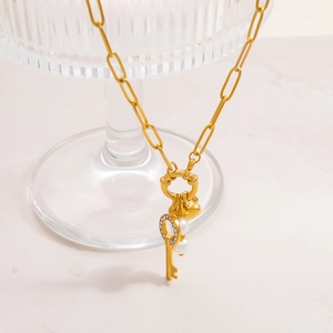 Gold stainless steel necklace with vintage key pendant, heart tag and white pearls