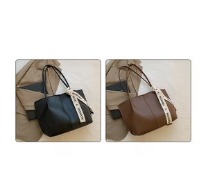 Detail of large capacity faux leather tote bags in black and brown with ribbon handles