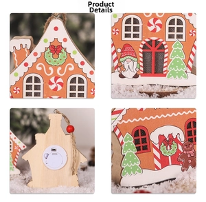 Close-up of lighted wooden gingerbread house ornament with gnome and battery compartment