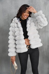 Detail showing the horizontal bubble texture on the plush faux fur jacket fabric