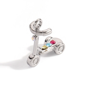 Detail of silver scooter pendant with four sparkling multi-colored gemstones