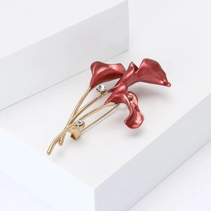 Artistic alloy enamel tulip brooch with red petals and golden stems on a clean background