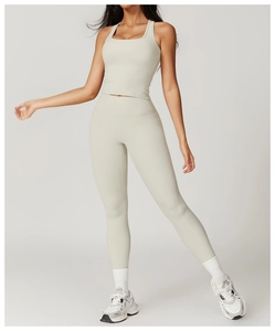 Detailed shot of bone white high-waist yoga set featuring a square neck racerback top