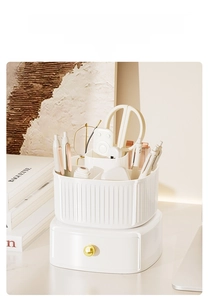 Close-up of a white textured desk organizer with gold handle and multi-grid compartments
