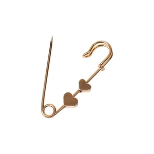 Elegant gold metal waist pin with three heart pendants on a clean white background