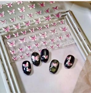 Detail of M-1016 butterfly nail stickers with silver glitter and pink gradient on black nails