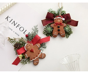 Detailed Christmas gingerbread man ornaments with resin texture, pine cones and red berries