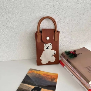 Detailed knit of caramel brown crossbody phone bag with cute white bear pattern