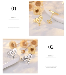 Detailed view of hollow heart stud earrings in polished gold and silver finishes
