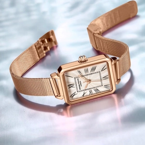 Elegant rose gold square women's watch featuring Roman numerals and a mesh steel strap