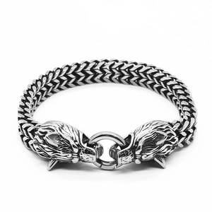 Men's stainless steel Viking bracelet featuring dual dragon heads and a woven chain
