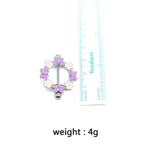 Size measurement of flower butterfly nipple ring with ruler showing 3.5cm diameter