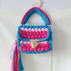 Handmade woven crossbody bag in blue and pink stripe fabric with a gold chain strap