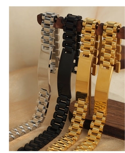 Detailed view of geometric titanium steel bracelets in silver, black and gold finishes