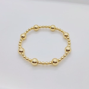 Bracciale elastico a sfere placcato oro 18K con finitura metallica super lucida