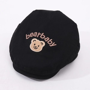 Detail view of a black cotton baby flat cap featuring brown bear and bearbaby embroidery
