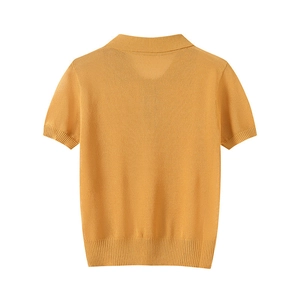 Ginger yellow short sleeve knit polo shirt with ribbed trim shown from the back view