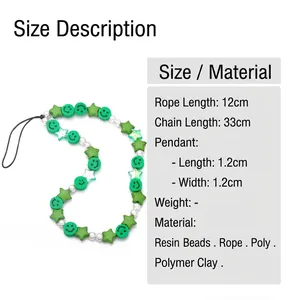 Bohemian style beaded phone lanyard with green smiley face, pearls and acrylic stars