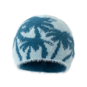 Close-up of the fluffy blue spider web jacquard texture on this warm winter beanie