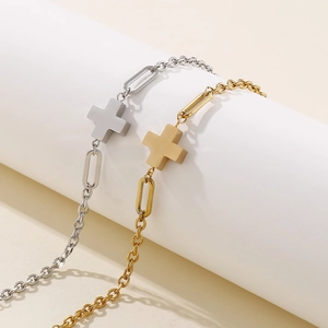 Minimalist stainless steel cross bracelet in gold and silver finish with link chain