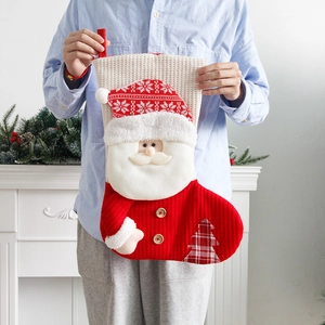 Large knitted Christmas stocking with Santa Claus design for holiday gifts and decor