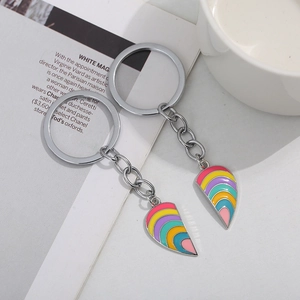 Rainbow heart-shaped couple keychain with puzzle fox design in polished silver metal finish