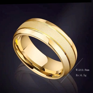 Detail of 8mm matte 18K gold titanium ring with polished edges and reflective finish