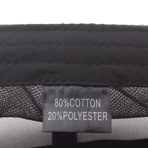 Mesh baseball cap detail showing 80% cotton 20% polyester material label on black fabric