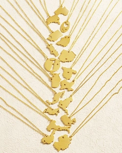 Collection of golden minimalist city map necklaces with delicate heart-shaped cutouts