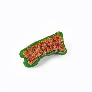 Realistic PVC green pepper stuffed with meat keychain model on white background
