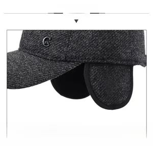 Detail of wool blend winter hat with herringbone pattern and foldable ear protection flaps