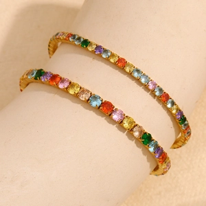 Detail of 18K gold-plated stretch bracelet with colorful cubic zirconia stones on stand