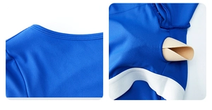 Macro view of blue yoga jumpsuit showing precise stitching and removable chest pad pockets