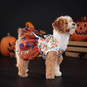 Detail of Halloween pet dress featuring pumpkin prints and black sequin bow decoration