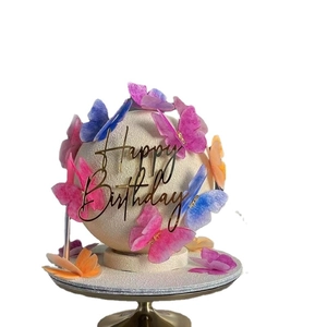 Birthday cake sphere with colorful butterfly decorations and gold Happy Birthday topper