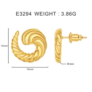 Detail view of twisted gold earrings with 15mm diameter and brass material specifications