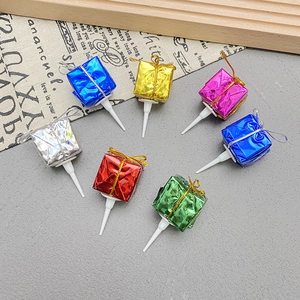 Colorful mini gift box cake toppers with metallic finish for festive party decoration
