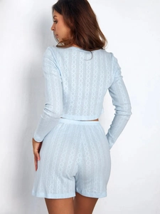 Detailed back view of light blue knit lounge set with hollow diamond patterns and texture