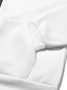Macro detail of high-quality white cotton fabric and ribbed cuff on a zip-up hoodie