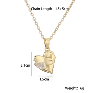 Close-up of gold heart pendant with teardrop zircon and size specifications