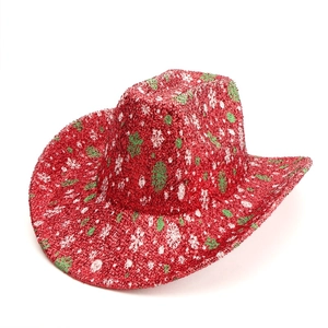 Top view of a red cowboy hat with green and white glitter for Christmas parties
