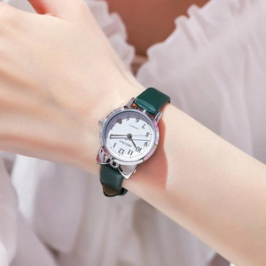 Cute women's quartz watch with green leather strap and cat ear shaped silver case