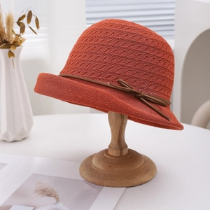 Breathable woven sun hat for women featuring a stylish rolled brim and ribbon bow detail