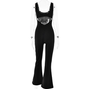 Detailed back view of a black backless jumpsuit with unique cut-out and waist pleats
