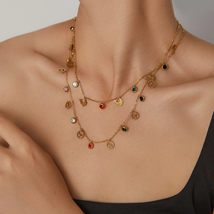 Detail of double-layer gold titanium chain with colorful zircon and dragonfly charm
