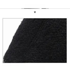 Detail view of the durable stitching on top of the black warm winter flat cap fabric